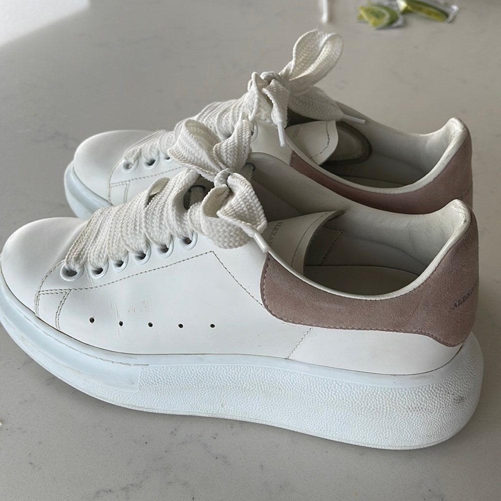 Alexander McQueen sneakers with pink back.
